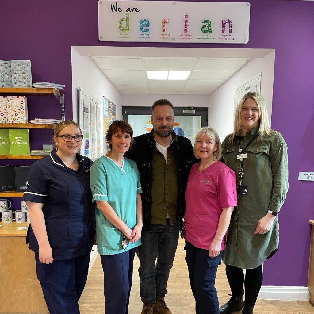Broadway legend Alfie Boe brightens Monday morning for children and staff at Derian House