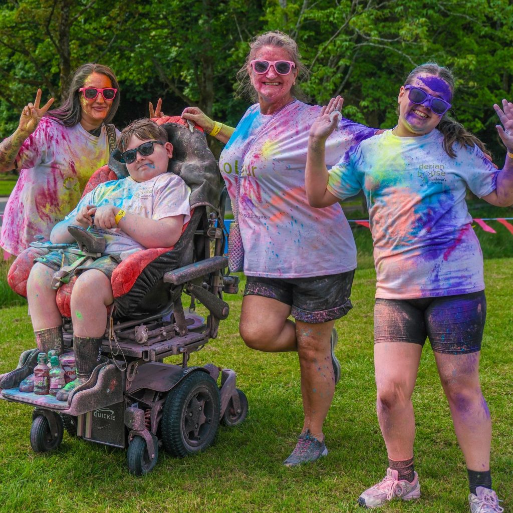 Runners covered in the colours of the rainbow in Derian House brand new fun run